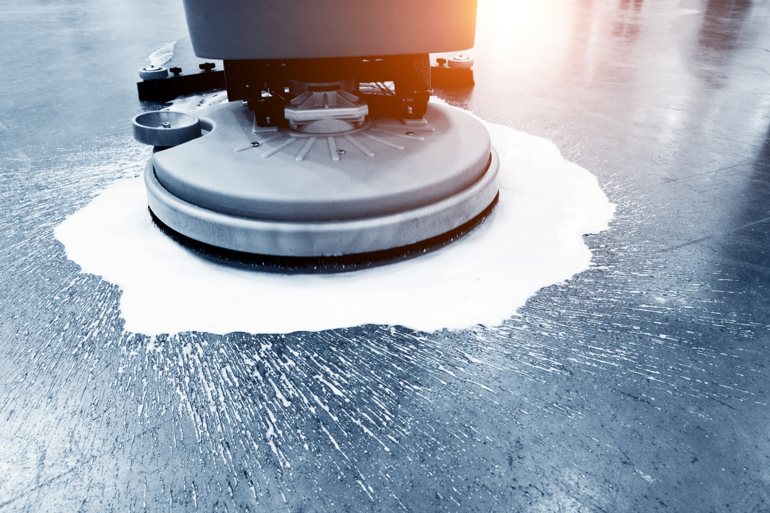 High contrast Image of a Floor being buffed and polished