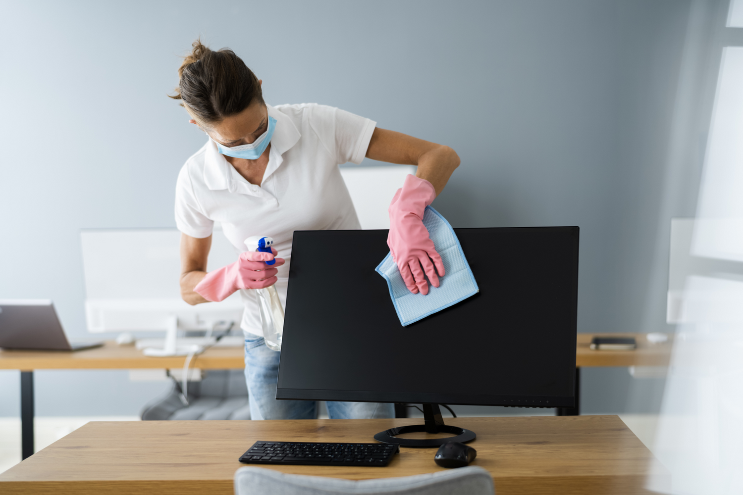 Image of an employee cleaning a Salem Area Office